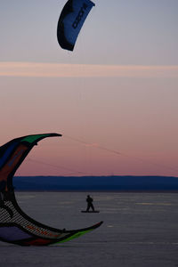 Silhouette of people at sunset