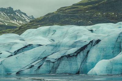Huge glacier on sea coast landscape photo
