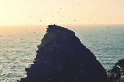 Scenic view of sea against sky at sunset