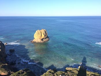 Scenic view of sea against clear blue sky