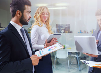 Business colleagues working in office