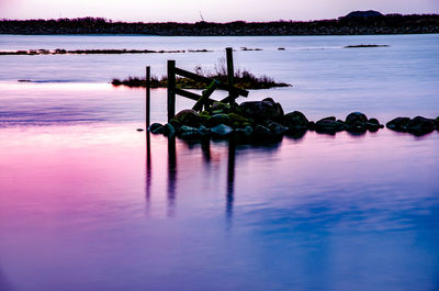 Scenic view of sea against sky at sunset