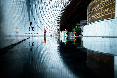 Reflection of building on floor in city