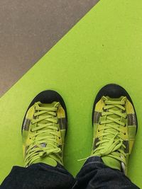 Low section of man wearing shoes