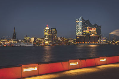 Germany, hamburg, cityscape with elbe philharmonic hall illuminated at night