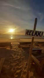 Scenic view of beach against sky during sunset