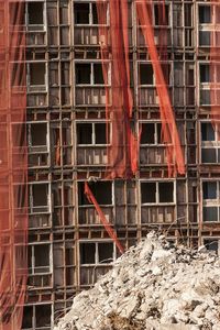 Red working at construction site