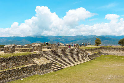 Group of people on the wall of a landscape