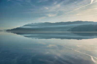 Perfect reflection on misty lake windermere