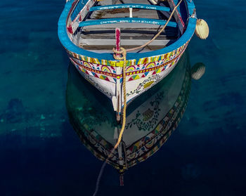 Close-up of boat moored in sea