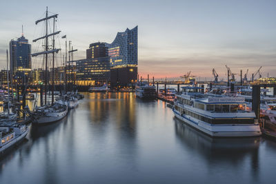 Boats moored at harbor