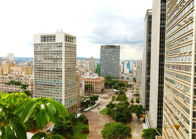 Buildings in city against sky