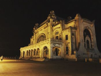 Low angle view of illuminated building at night