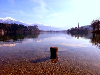 Scenic view of lake and mountains against sky