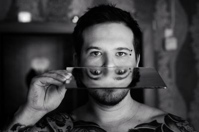 Portrait of young woman using mobile phone