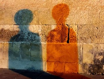 Shadow of statue on wall