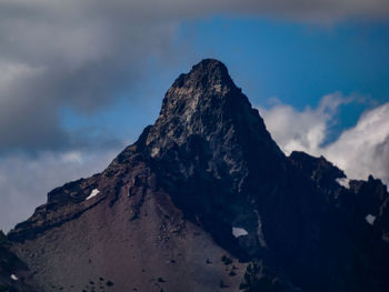 Low angle view of rock formation against sky