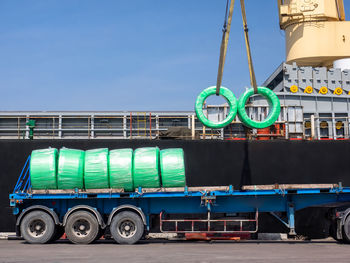 The vessel discharging steel wire rods on truck at industrial port of thailand.