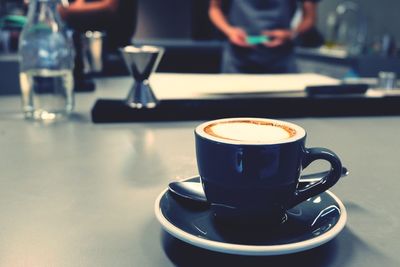 Close-up of coffee cup on table