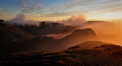 Scenic view of mountains against sky during sunset