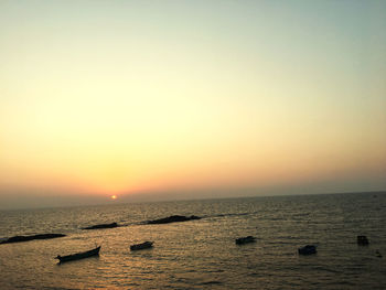 Scenic view of sea against clear sky during sunset