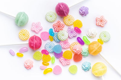 High angle view of candies on white background