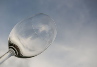 Low angle view of glass against sky