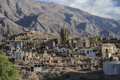 High angle view of townscape and mountains against sky