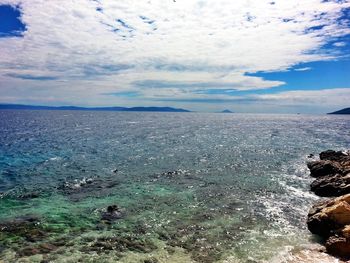 Scenic view of sea against cloudy sky