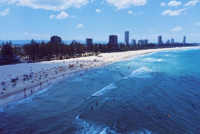 Panoramic view of sea and buildings against sky