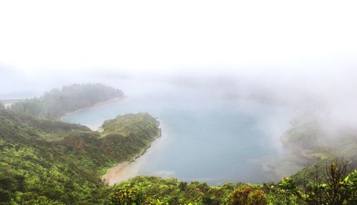Scenic view of mountains against cloudy sky