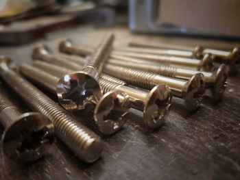 Close-up of nails on table