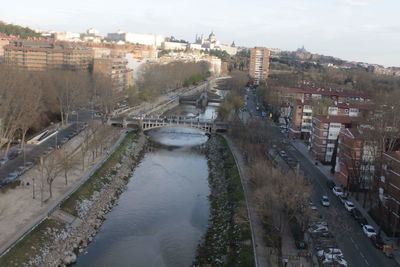 High angle view of river amidst city