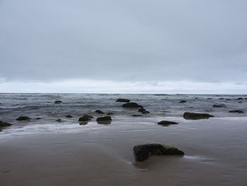 Scenic view of sea against cloudy sky