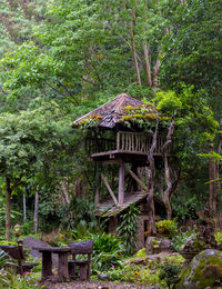 Gazebo on roof against trees