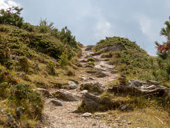 Scenic view of waterfall against sky