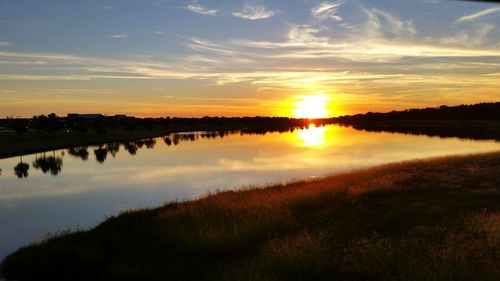 Scenic view of sunset over lake