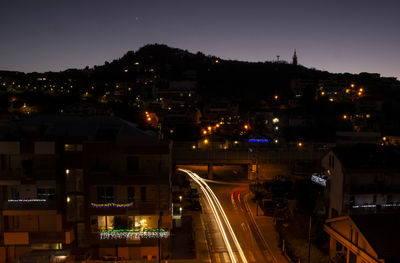 High angle view of illuminated buildings in city at night