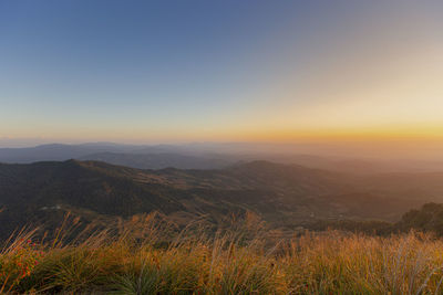 Scenic view of landscape against sky during sunset