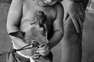 Close-up of child with a dog