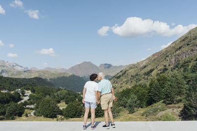 Back view of kissing senior couple, jaca, spain