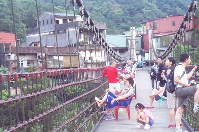 People in front of traditional building