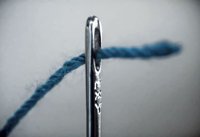 Close-up of metal tied on table