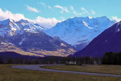 Scenic view of snowcapped mountains against sky