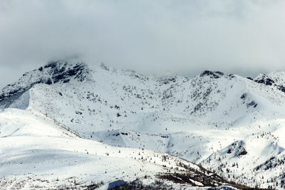 Scenic view of snowcapped mountains during winter