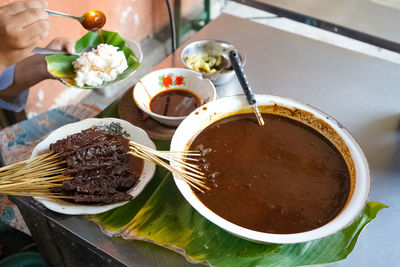 Buffalo satay is a traditional food from kudus, central java, indonesia that uses peanut sauce.