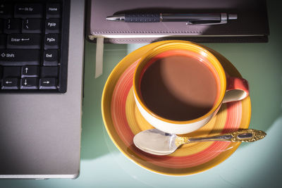 High angle view of coffee cup on table