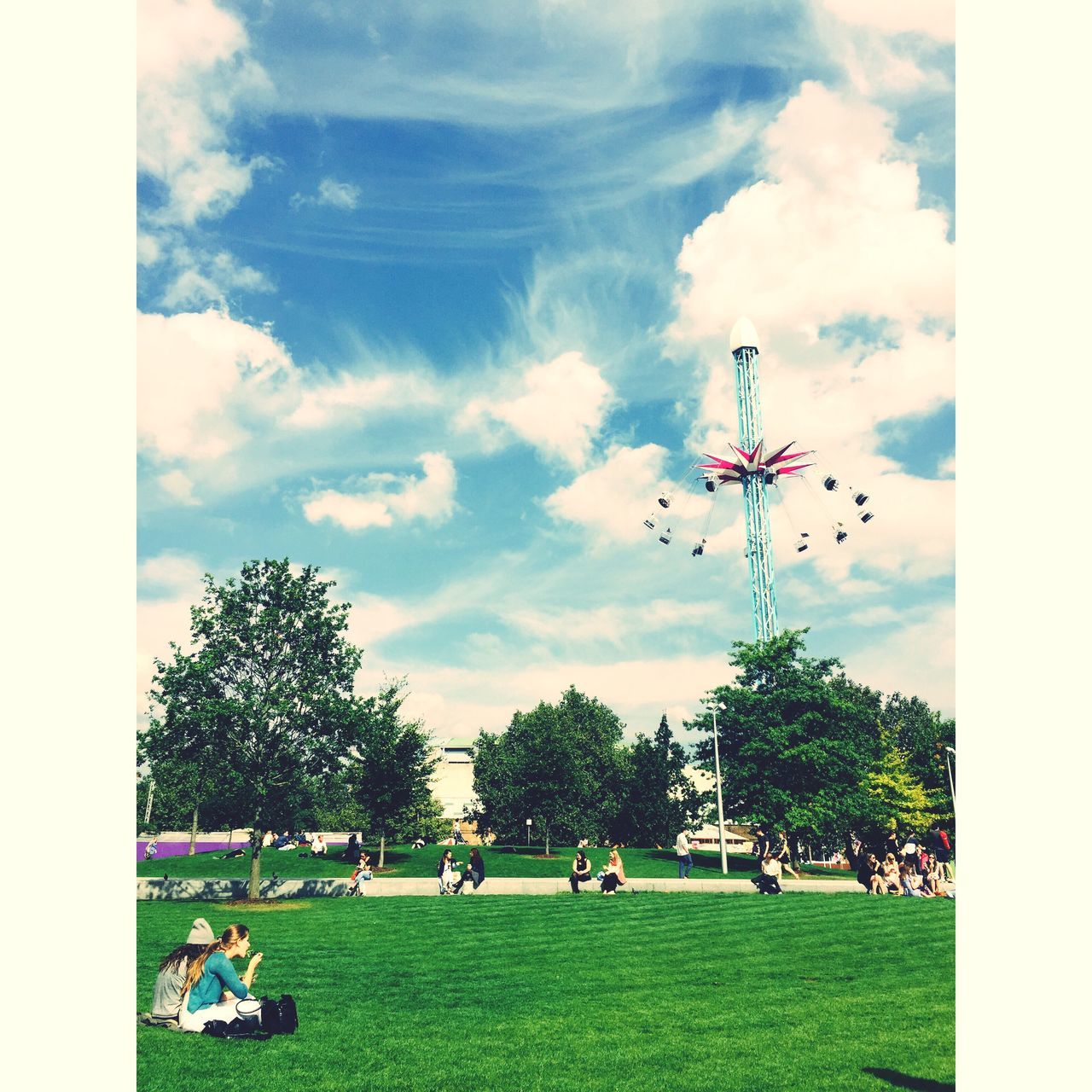 large group of people, sky, leisure activity, tree, lifestyles, cloud - sky, men, grass, transfer print, person, mixed age range, park - man made space, cloud, enjoyment, green color, cloudy, sport, fun, field