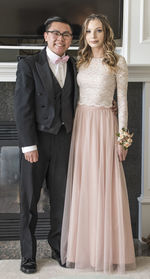 Portrait of well dressed couple standing at home