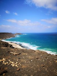 Scenic view of beach against sky